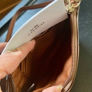 Never used brown 4” x 6” Coach wristlet!